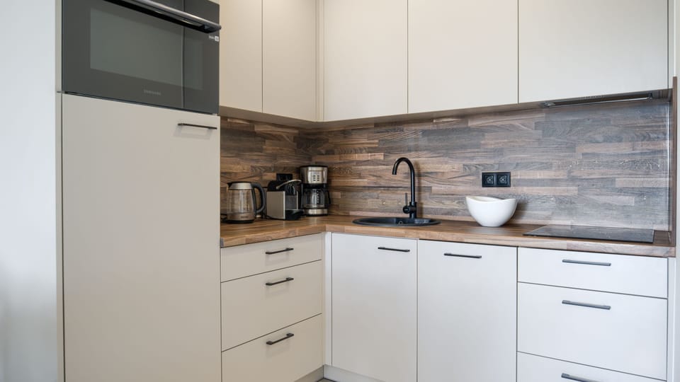 Apartment (419) | Private kitchenette | Fridge, stovetop, electric kettle, cookware/dishes/utensils