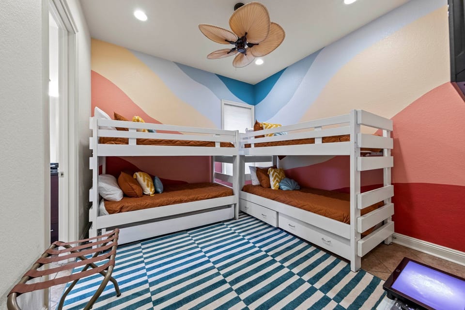 Vibrant Dreams: A bright and cheerful bunk room invites guests to enjoy a fun, colorful retreat, sparking creativity and dreams of adventure. 🛌🌈✨