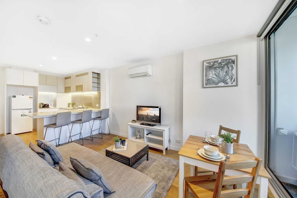 The living area with a 3-seater sofa bed.