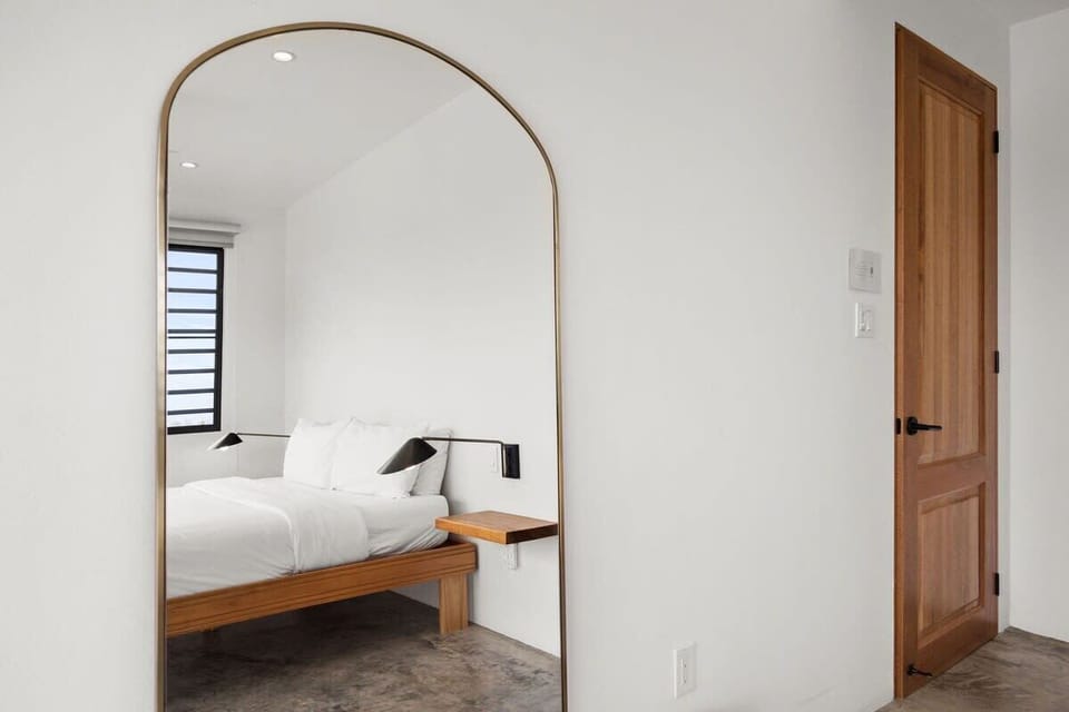 Second bedroom with its own king bed, AC unit and ensuite bathroom with shower, providing a luxurious retreat for guests.