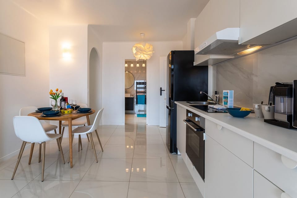 You’ll adore the dining room with its gorgeous wooden table for four, and the fully equipped kitchen with white furniture.