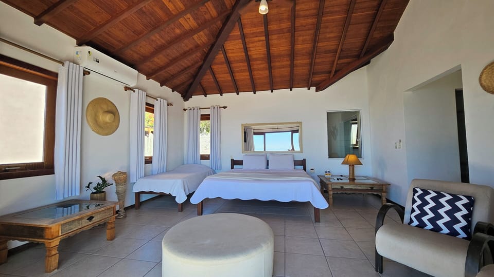 Deluxe Suite, Sea View | Minibar, blackout drapes, iron/ironing board, free WiFi