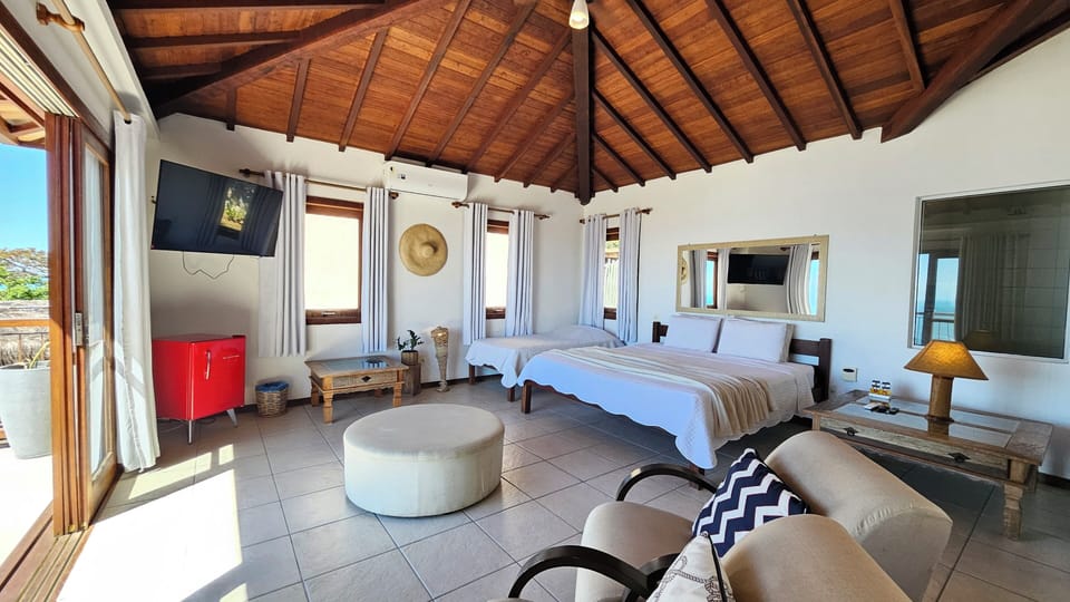 Deluxe Suite, Sea View | Minibar, blackout drapes, iron/ironing board, free WiFi