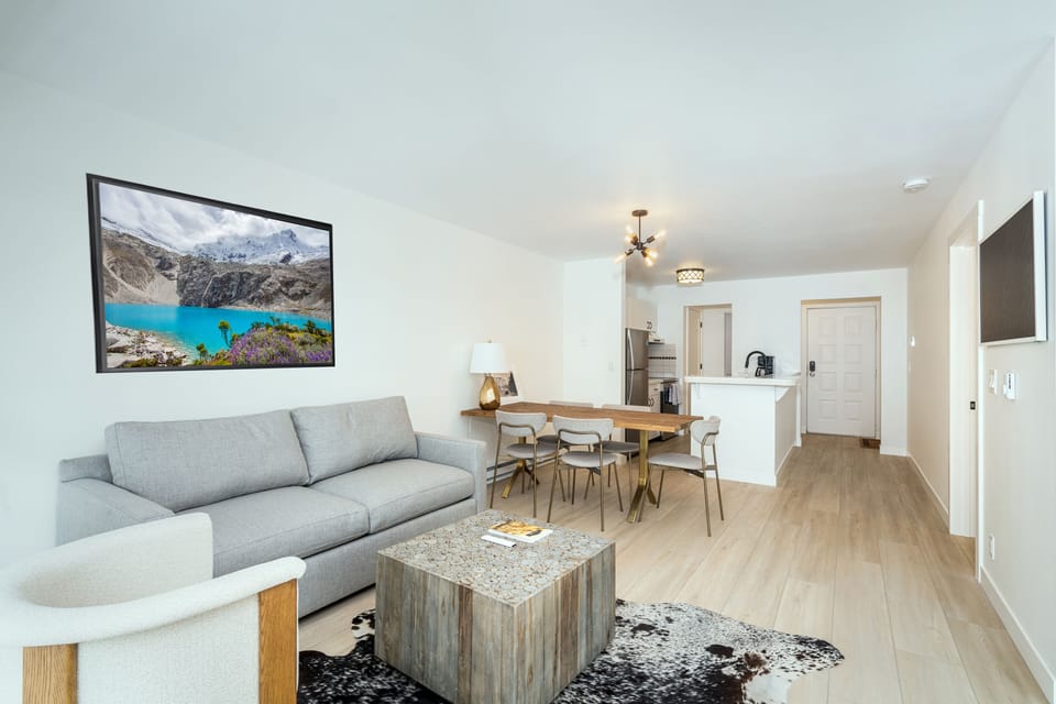 Living Room - Open concept bright and sunny living space with updated, fresh decor throughout