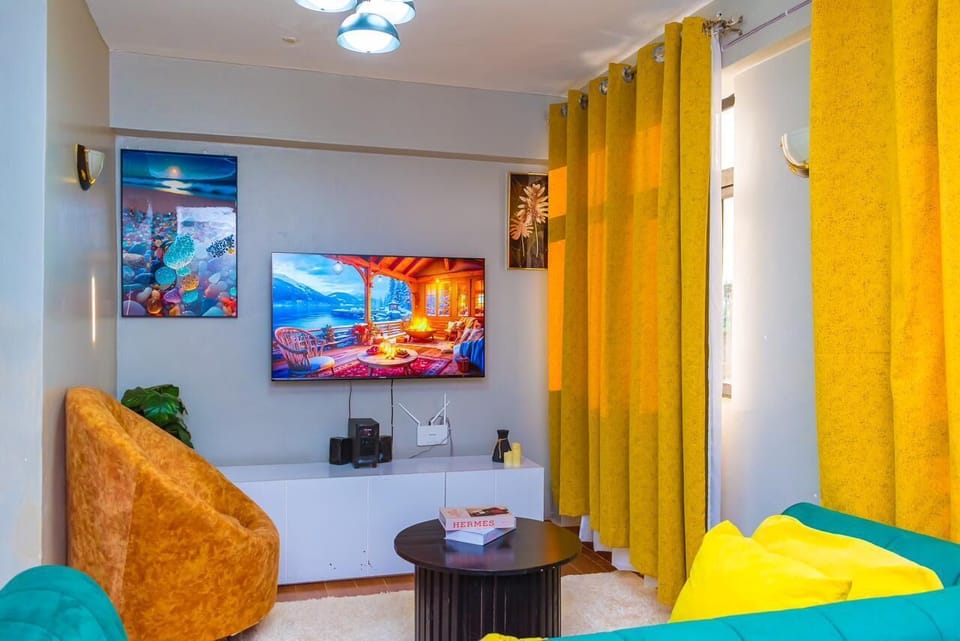 Business Apartment | Living area | 24-inch Smart TV with digital channels