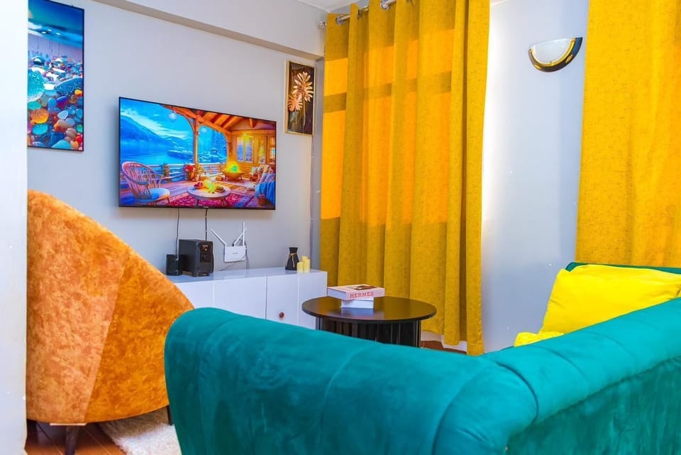 Business Apartment | Living area | 24-inch Smart TV with digital channels