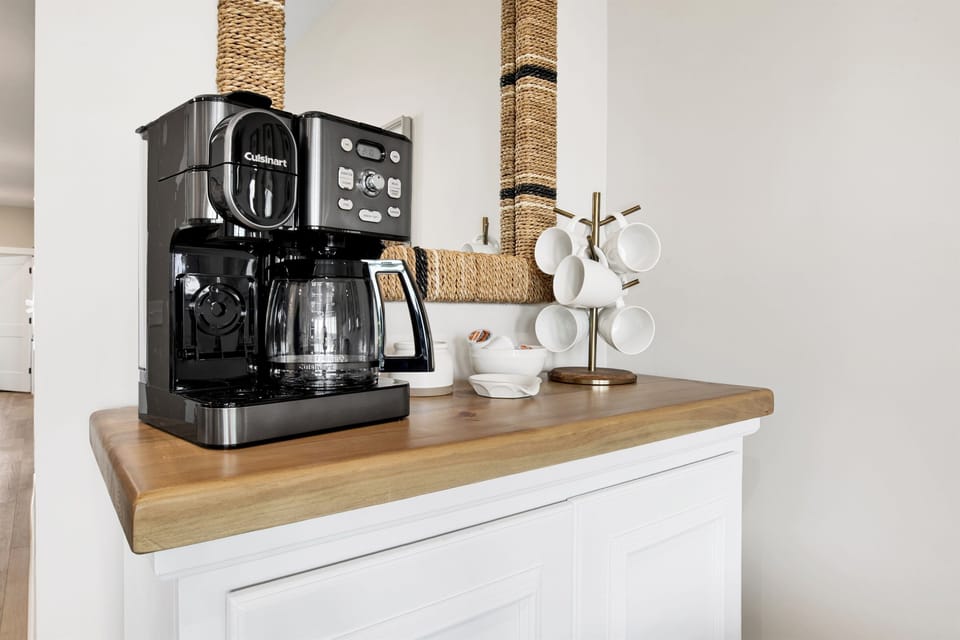 Begin your day with elegance and a perfect cup of coffee in this chic, warmly accented corner of the home.