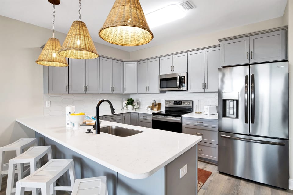 Chic and inviting, this kitchen is a modern haven of culinary delight, ready for family feasts and snack-time treats.