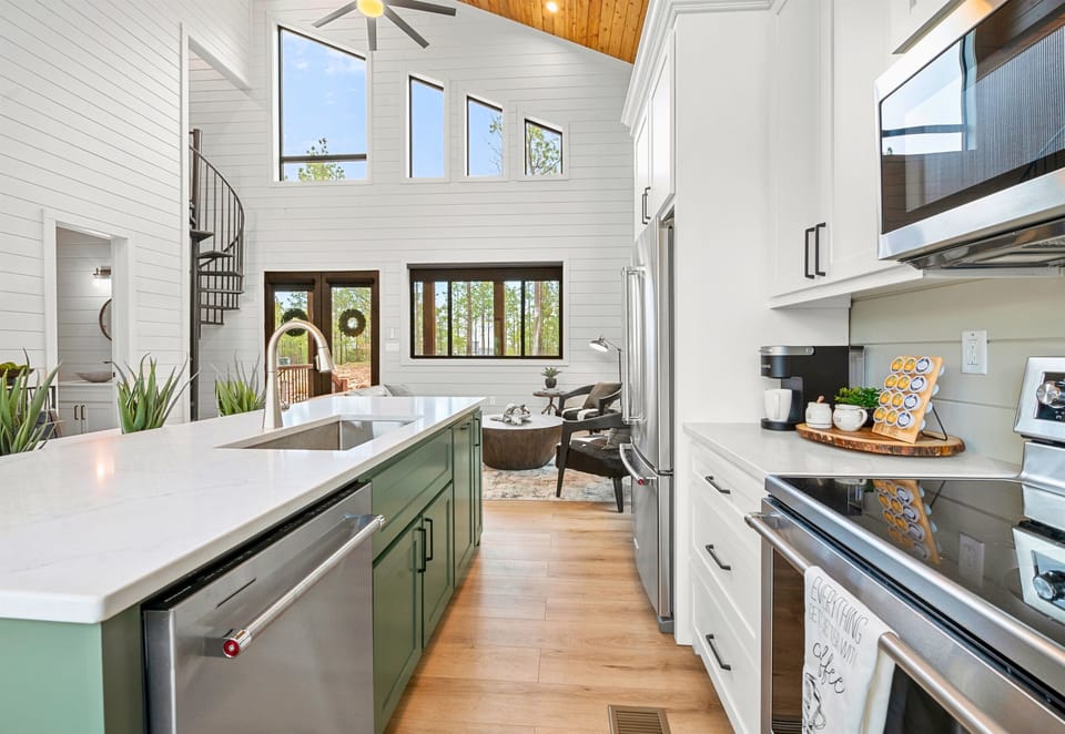 The kitchen is both elegant and practical, offering state-of-the-art appliances, ample counter space, and an inviting atmosphere.