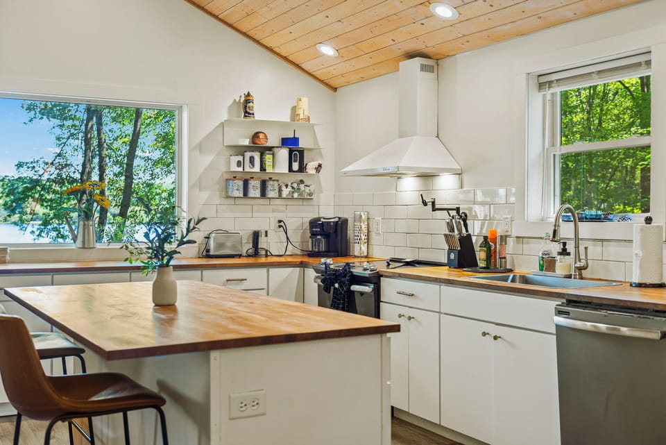 Kitchen is fully equipped and features an island.