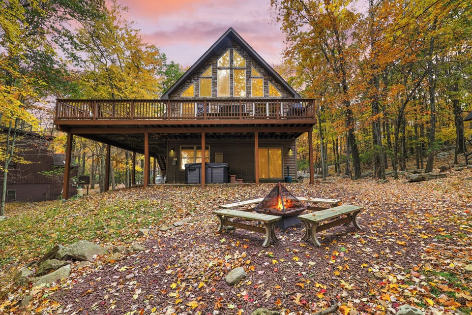 Charming exterior under the golden sky featuring a fire pit.