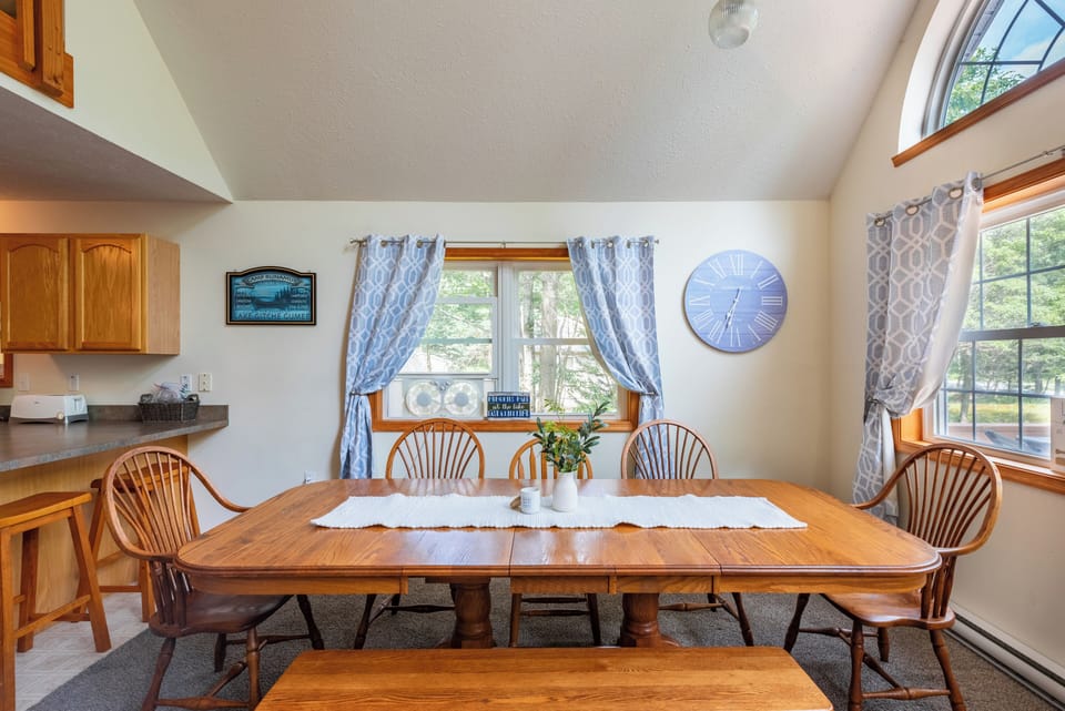 A mix of chairs and a bench for a casual dining space