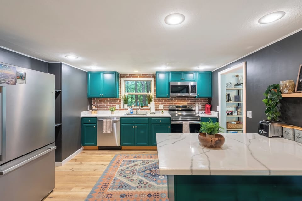 Modern kitchen with a pop of color. 