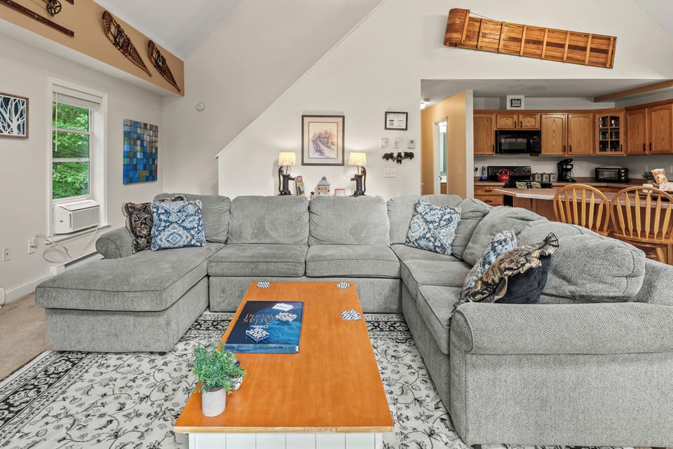 Curl up on the couch and enjoy a movie on the big screen in this inviting living room.