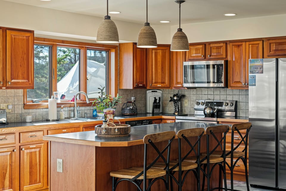 Barstool seating at the kitchen counter.