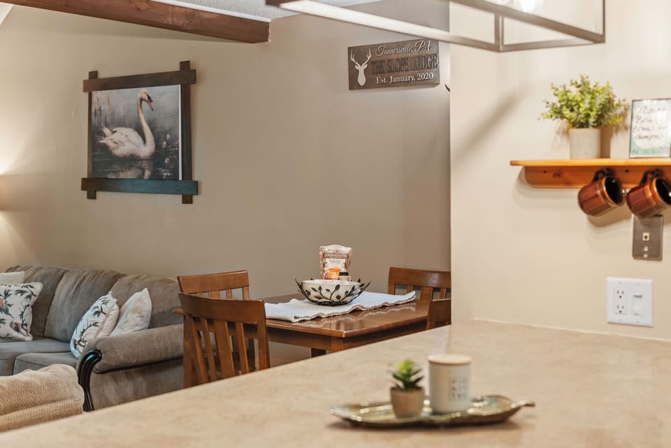 The breakfast bar in this kitchen provides a casual spot to chat with friends and family while you cook.