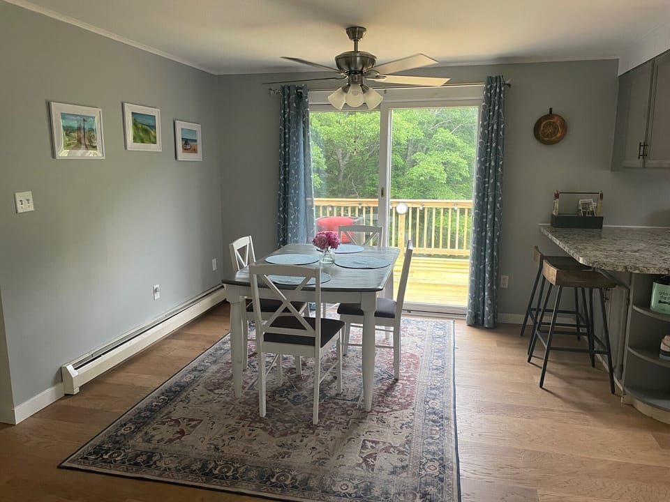 Dining room and entrance to spacious back deck