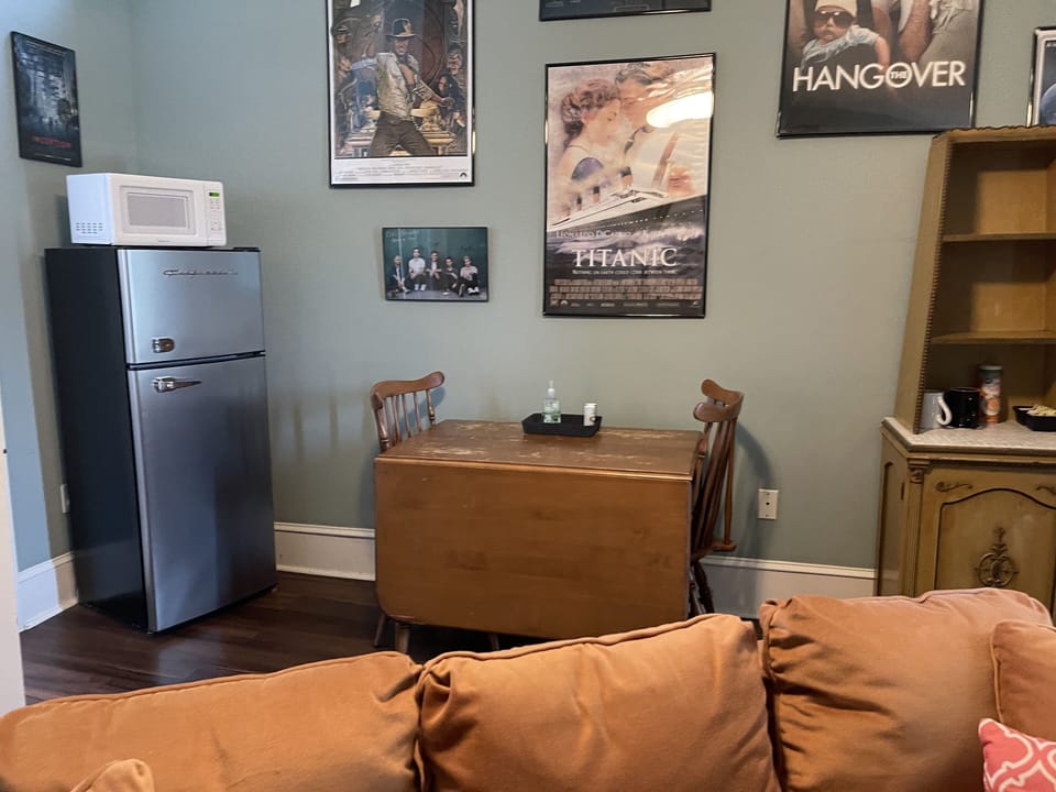 Living room has refrigerator/freezer, microwave and Keurig coffee maker