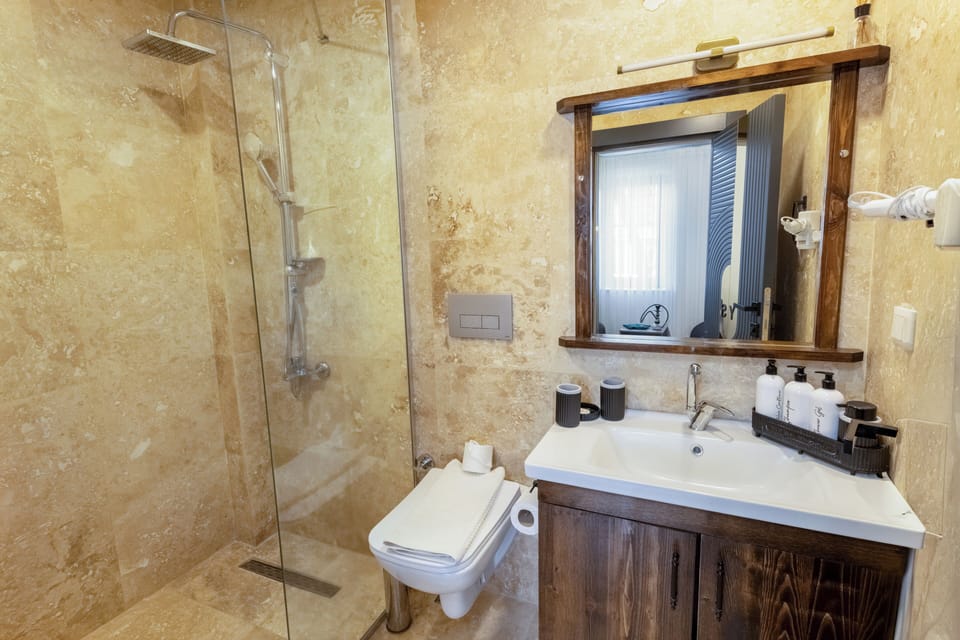 Signature Suite | Bathroom | Free toiletries, hair dryer, slippers, towels