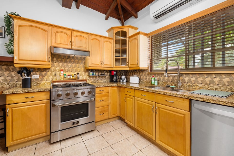 Fully equipped kitchen featuring a professional-grade gas range.