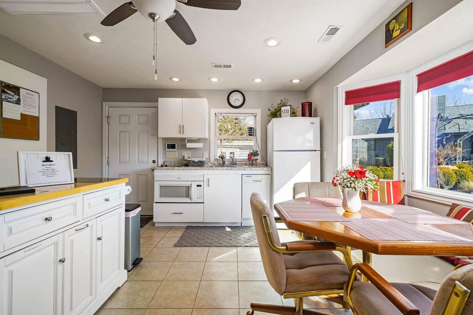 The kitchen area has a microwave, disposal, fridge with ice maker, cooktop, dishwasher, dishes and pots/pans. In the island you will find utensils and small appliances. There is a slide out pantry to right of the bathroom door with oil and spices.