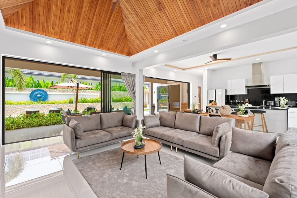 Exclusive Villa | Living area | 65-inch TV with cable channels