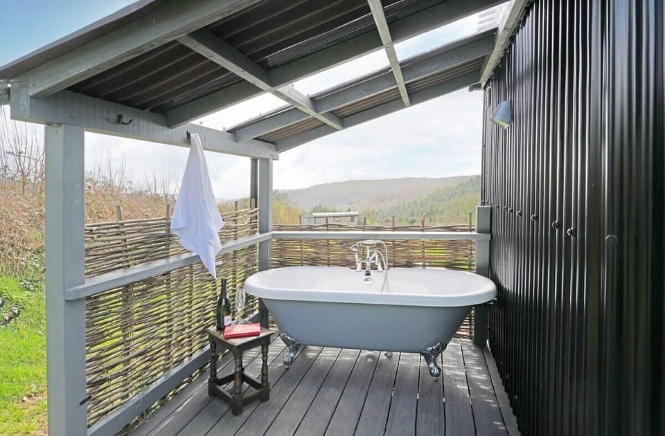 Luxurious outdoor bath with distant sea views!