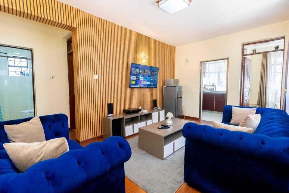 Deluxe Apartment | Living area | 24-inch Smart TV with digital channels