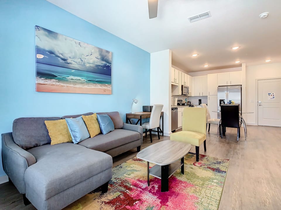 Relax and unwind in this stylish and cozy living room with 50 inch TV and futon.