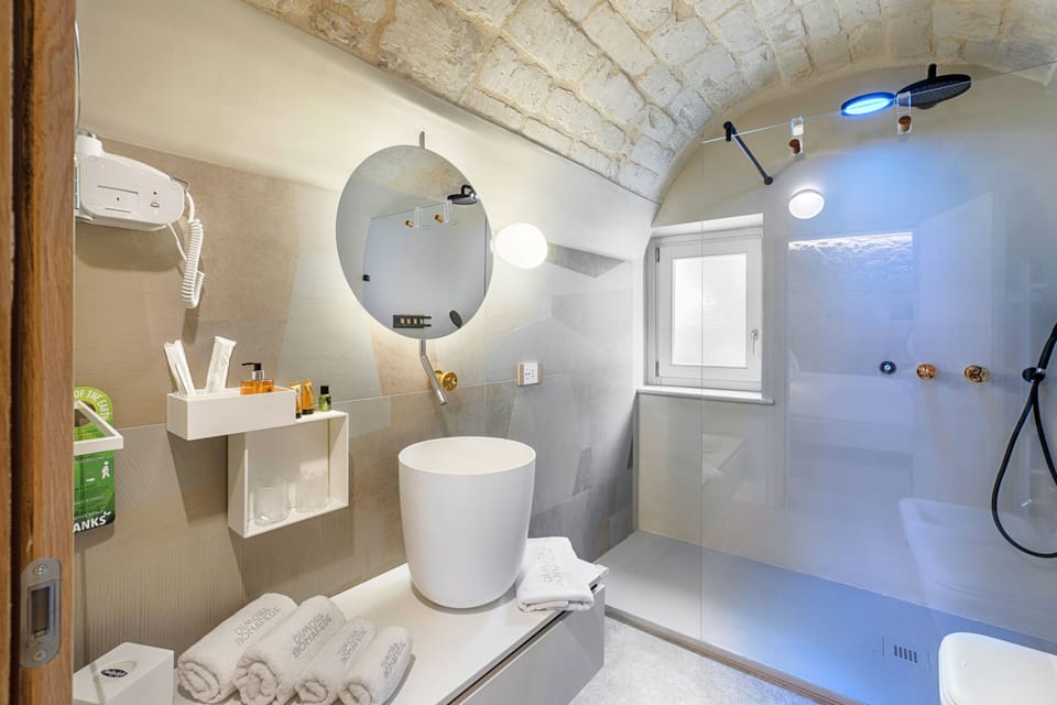 Deluxe Room | Bathroom | Shower, designer toiletries, hair dryer, bathrobes
