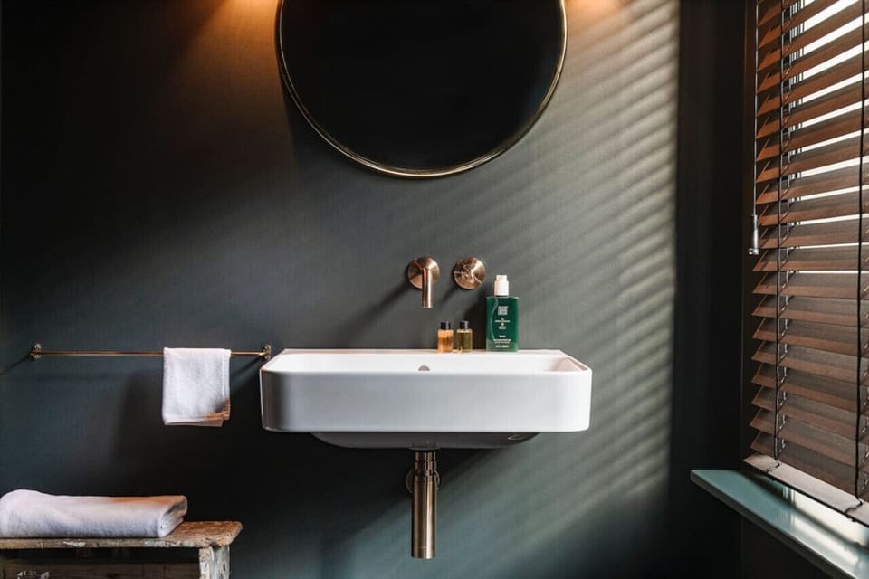 Bathroom scenery with sink and utilities.
