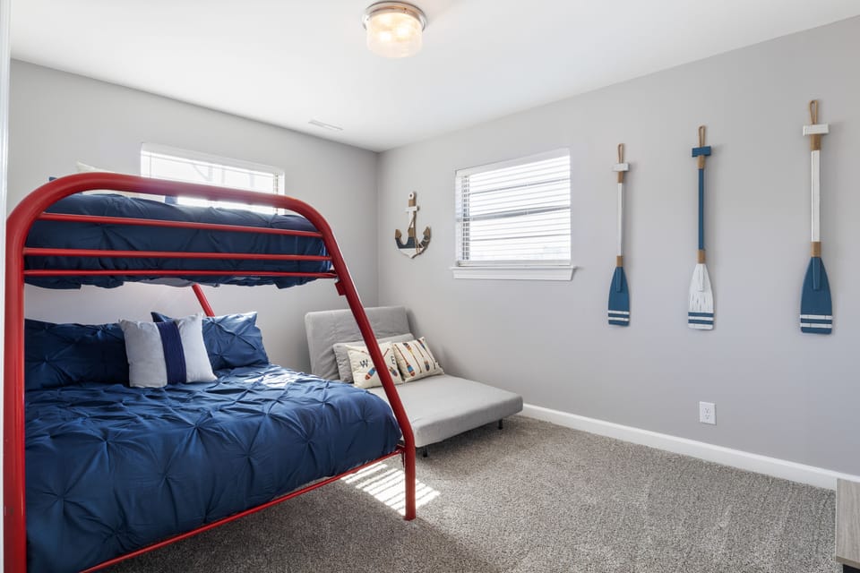 In here you'll have a Twin Convertible Chair, Smart TV, game console table, and HDMI cable.