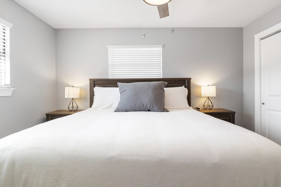 There are 2 bedside tables w/ storage for your instant-grab belongings.