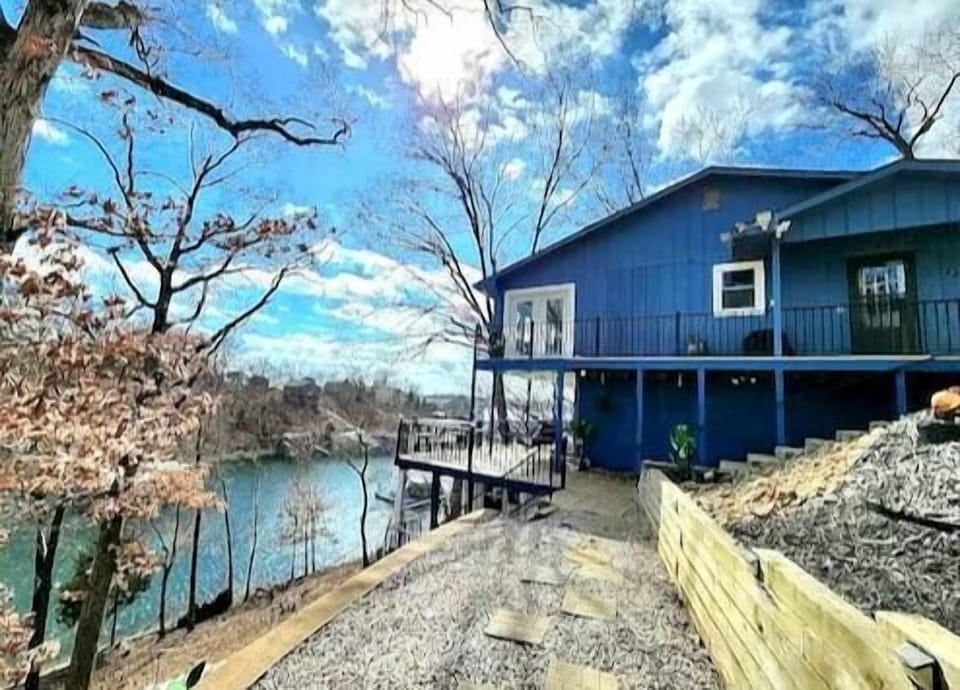 Lakeside home with stunning views and a spacious deck, perfect for a peaceful getaway.