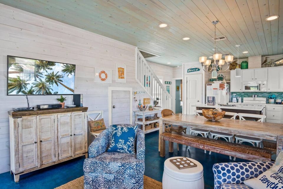 Stylish living and kitchen area with beachy vibes, ideal for laid-back lounging and seaside snacking.