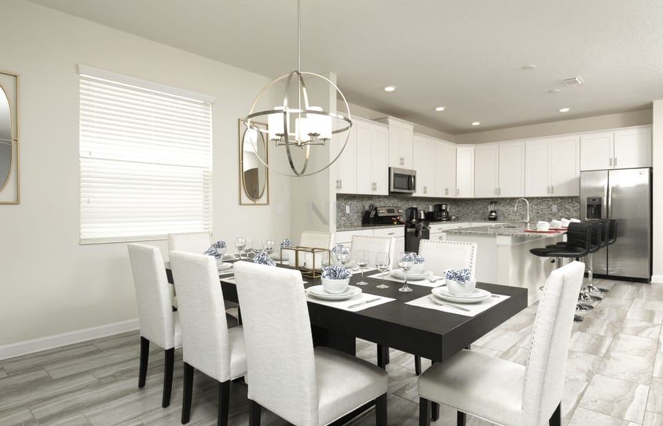 Dining table adorned with a stunning circular chandelier