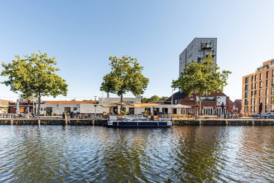 Scenic view of the waterfront with vibrant surroundings, providing a picturesque spot to enjoy the atmosphere and explore the area.