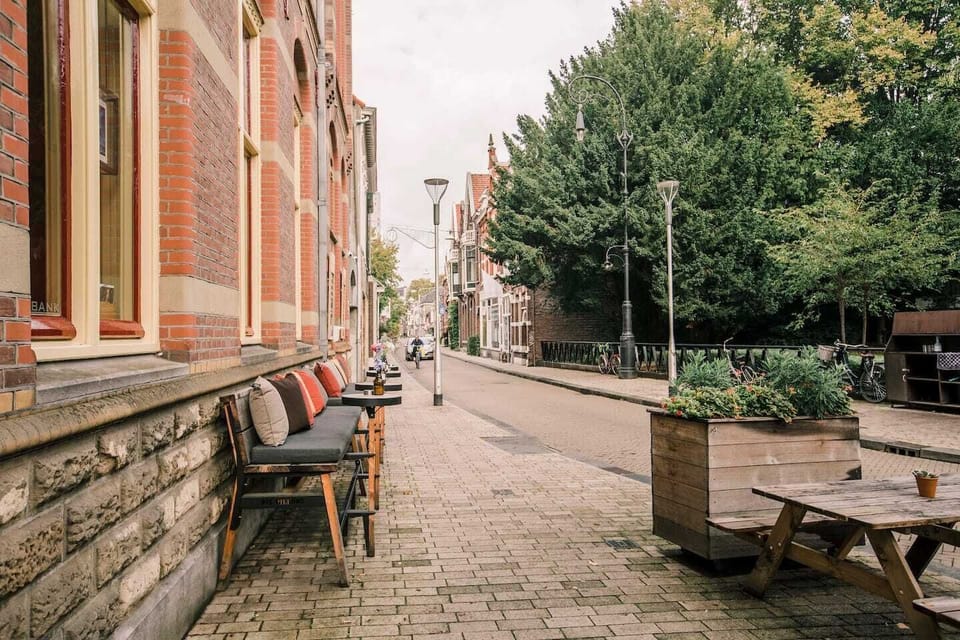 Scenic street view lined with greenery, offering a peaceful and charming environment for a pleasant stroll.