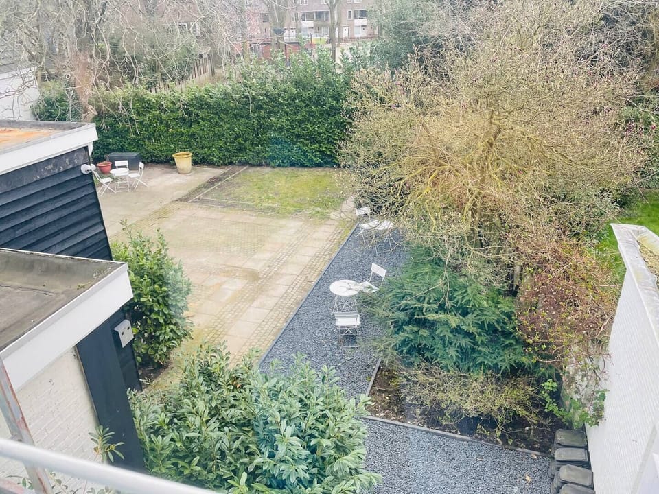 Peaceful and private outdoor area with seating, offering a tranquil environment for relaxation or casual gatherings.