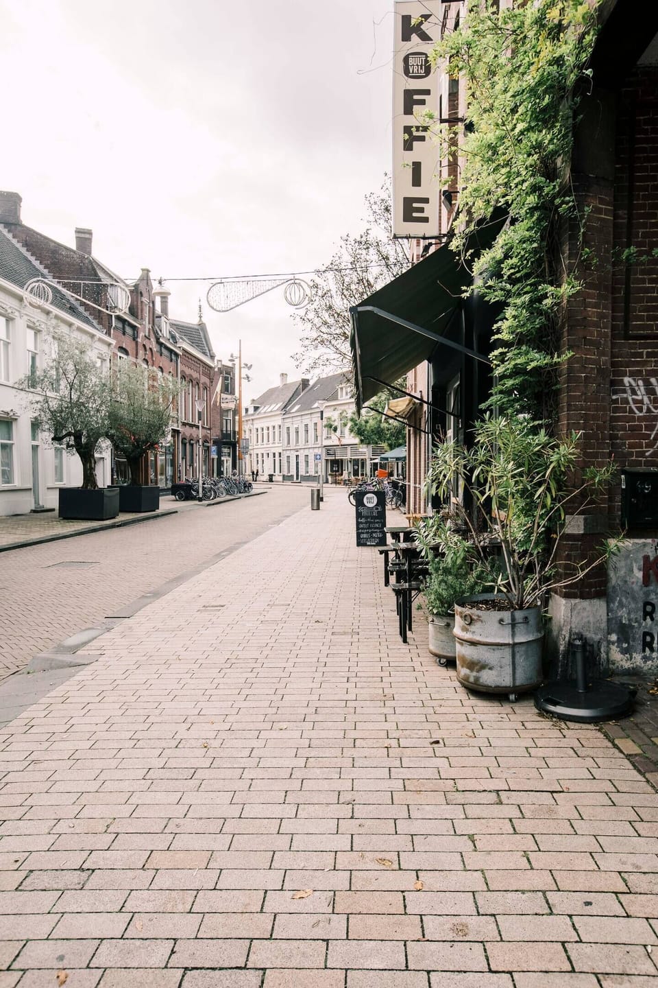 Charming street in the heart of Tilburg, lined with local cafés and quiet terraces — perfect for a relaxed morning stroll.