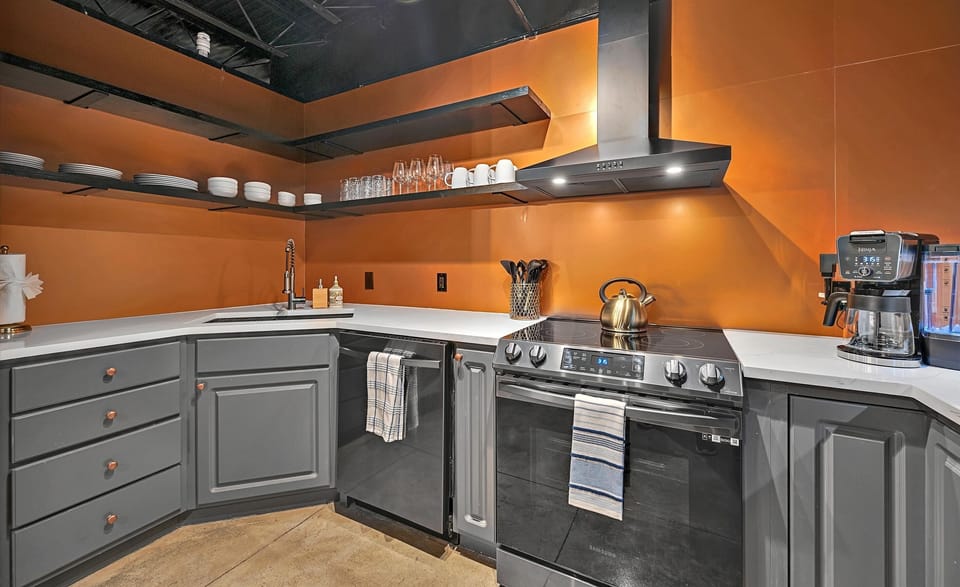 Whip up delicious meals with ease in this fully stocked kitchen, designed for both function and style.