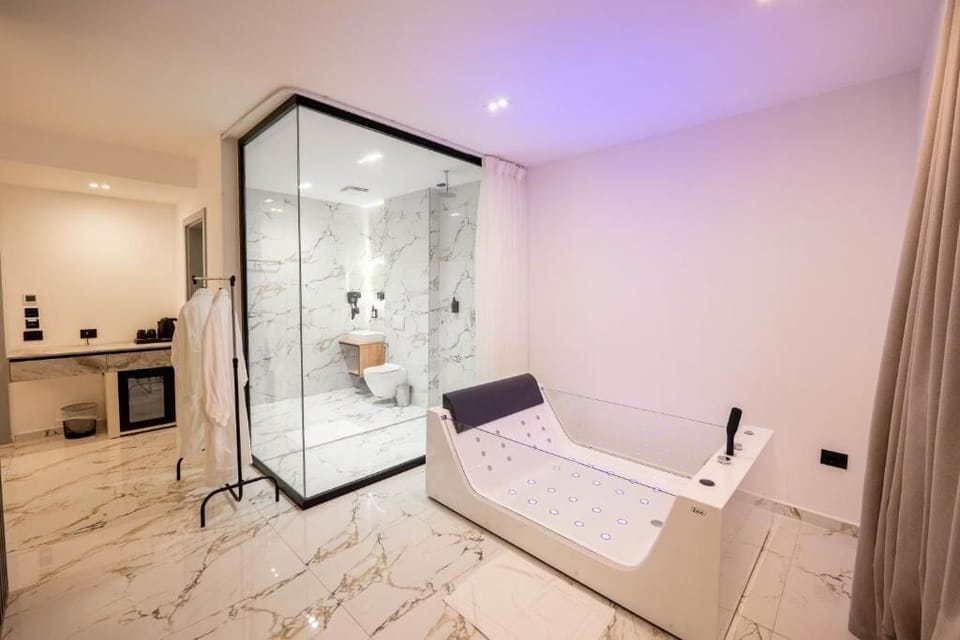 Suite, Sea View | Bathroom | Hair dryer, slippers