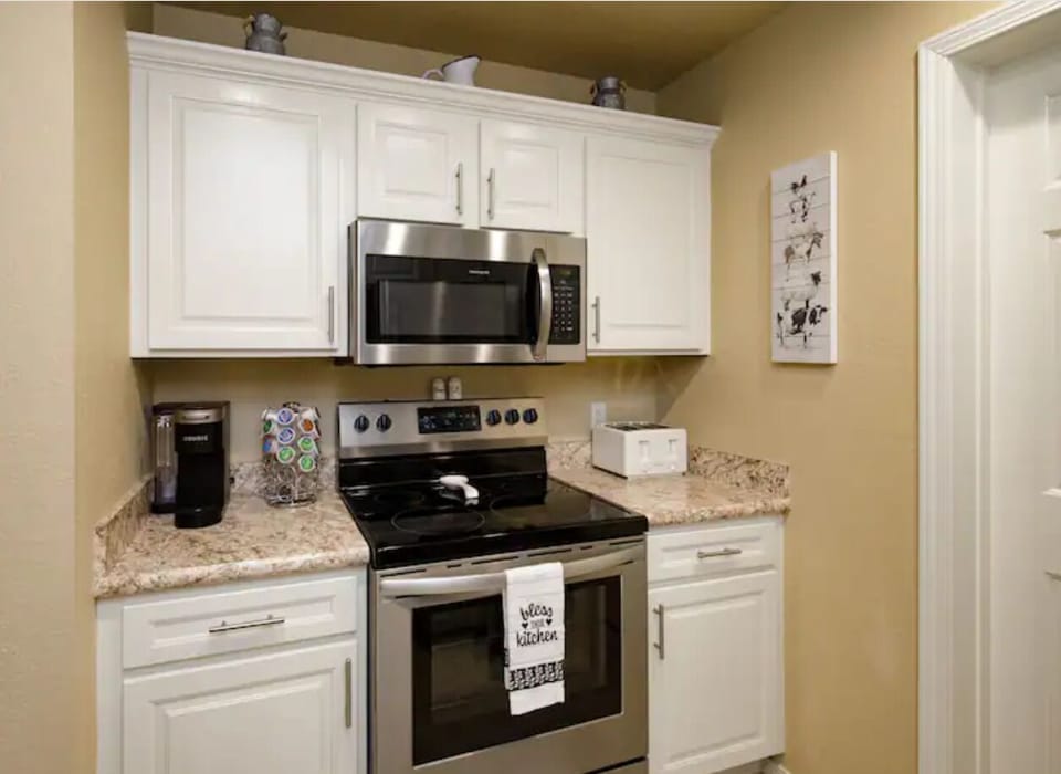Kitchen has stove and microwave 