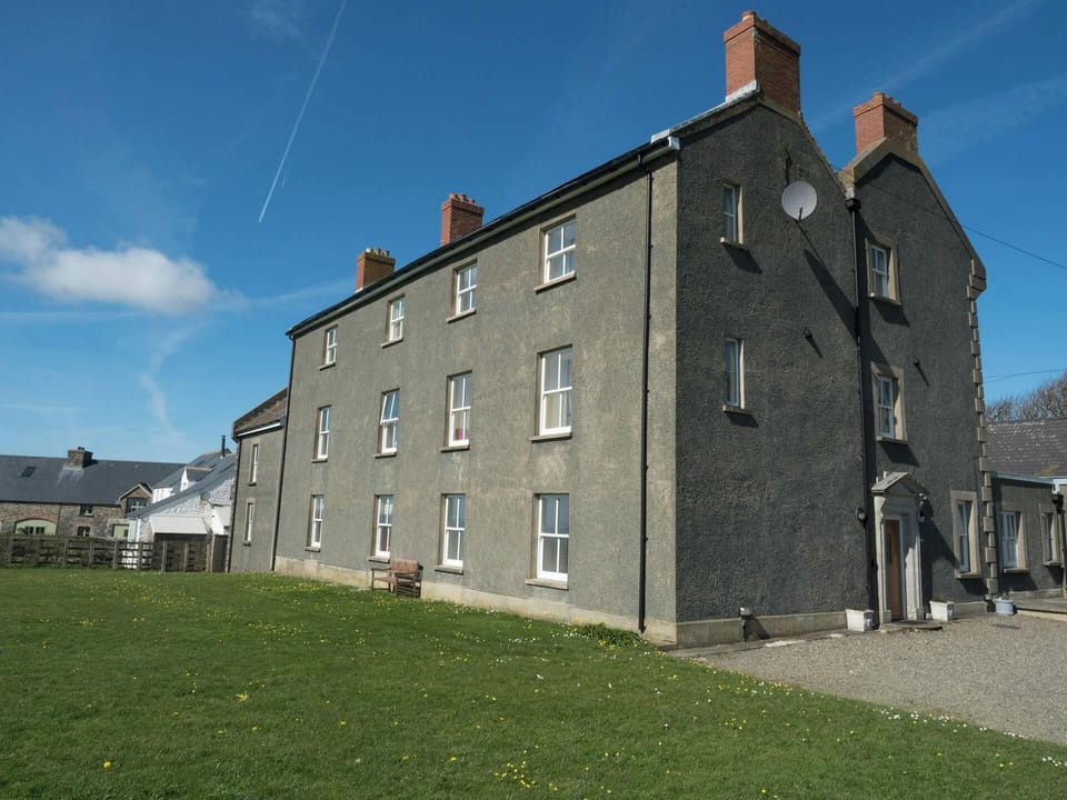 Exterior of large Georgian house, St Brides View is a first floor apartment
