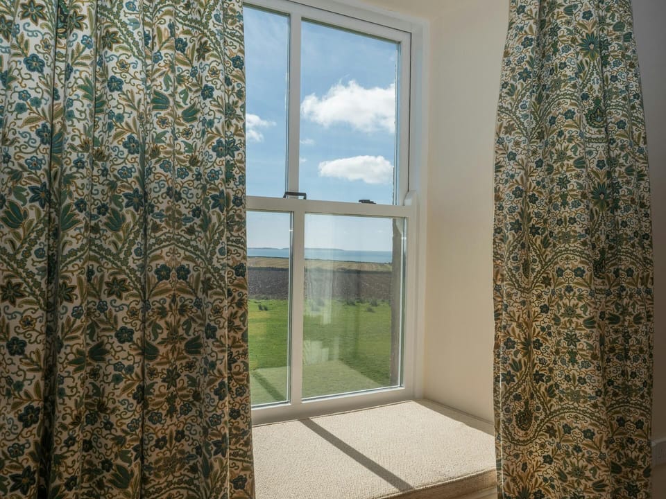 Sea views through the window at St Brides View
