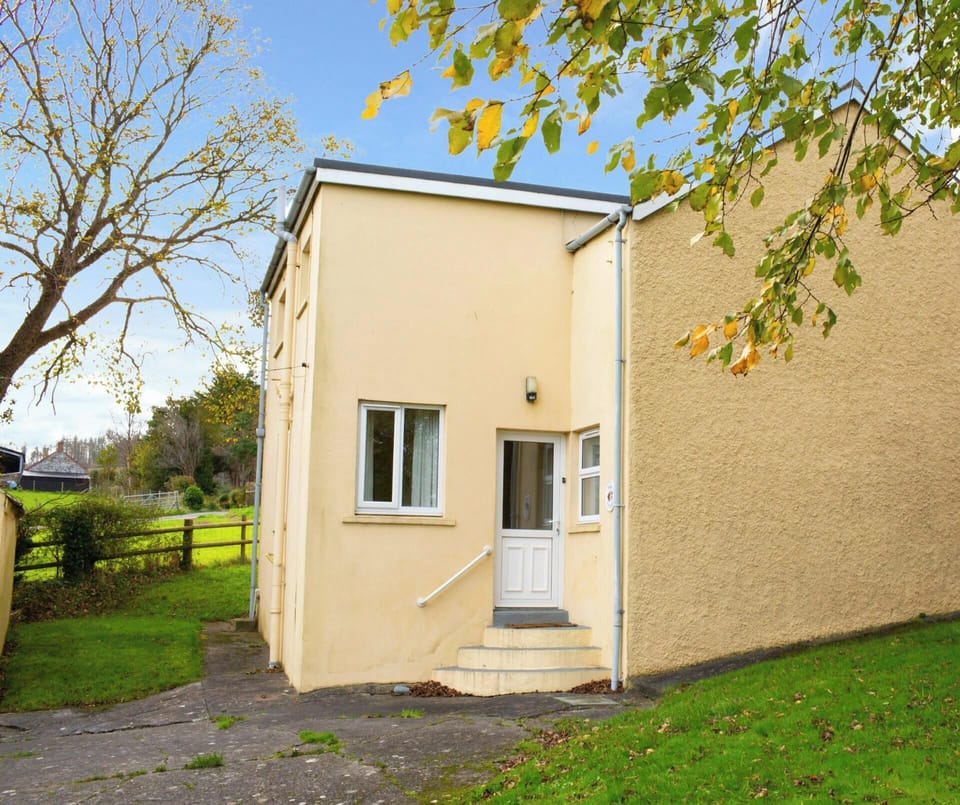Large lawn area outside the cottage with far reaching views