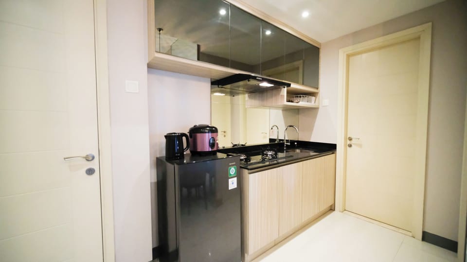 Apartment | Private kitchen | Full-size fridge, stovetop, electric kettle, cookware/dishes/utensils