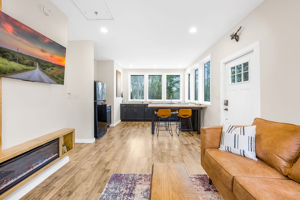 Open layout with wall to wall windows with view of the lake and woods.