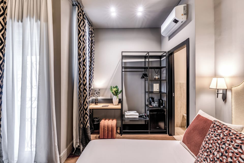 Deluxe Room | Down comforters, in-room safe, desk, laptop workspace