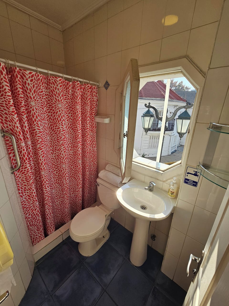 Shower, rainfall showerhead, hair dryer, towels